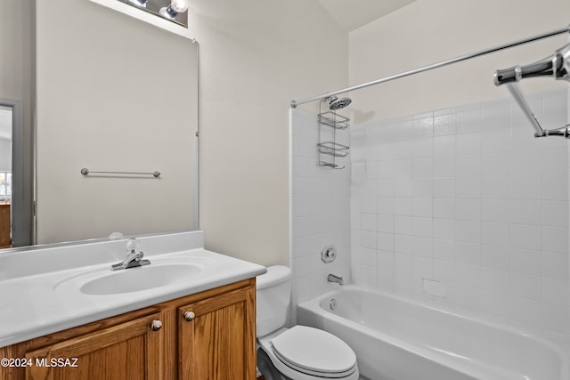 full bathroom with vanity, toilet, and tiled shower / bath combo