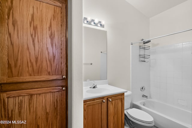 full bathroom with vanity, tiled shower / bath combo, and toilet