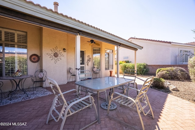 1955 E E Clf, Swallow Trail, Green Valley, AZ 85614 - view of patio / terrace featuring outdoor dining area and ceiling fan