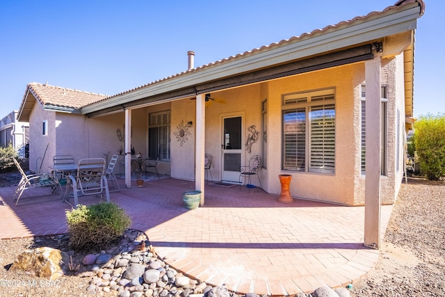 1955 E E Clf, Swallow Trail, Green Valley, AZ 85614 - back of property with a patio, a tiled roof, stucco siding, and ceiling fan