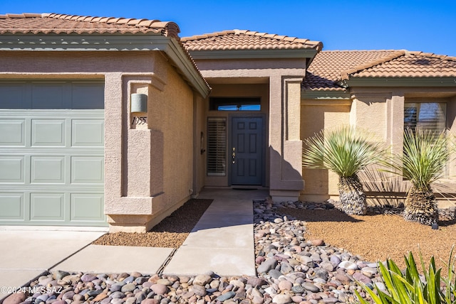 1955 E E Clf, Swallow Trail, Green Valley, AZ 85614 - entrance to property with a garage, stucco siding, and a tiled roof
