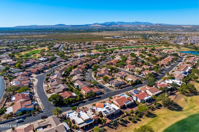 birds eye view of property with a mountain view