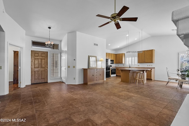 1955 E E Clf, Swallow Trail, Green Valley, AZ 85614 - kitchen featuring stove, a chandelier, high vaulted ceiling, a ceiling fan, and light countertops