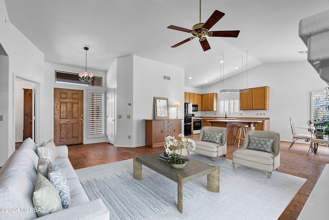 1955 E E Clf, Swallow Trail, Green Valley, AZ 85614 - living room with a chandelier, a ceiling fan, tile patterned flooring, high vaulted ceiling, and baseboards