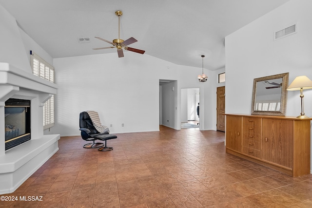 unfurnished living room featuring tile patterned flooring, ceiling fan, and high vaulted ceiling