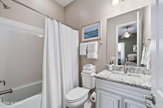 full bathroom featuring vanity, toilet, ceiling fan, and shower / bath combo with shower curtain