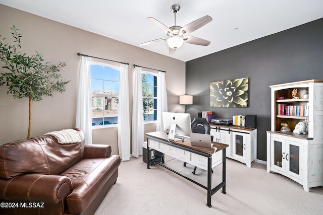 office with ceiling fan and light carpet