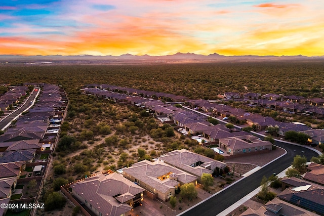 aerial view at dusk with a mountain view