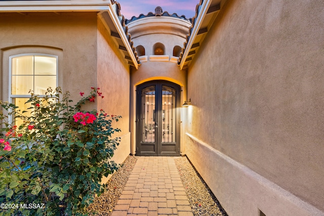 exterior entry at dusk with french doors