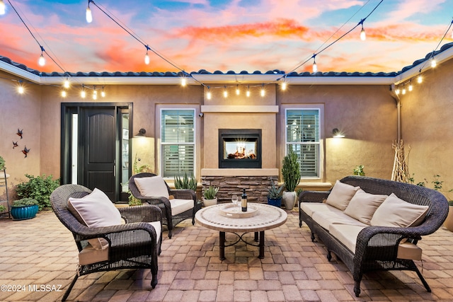 patio terrace at dusk with outdoor lounge area