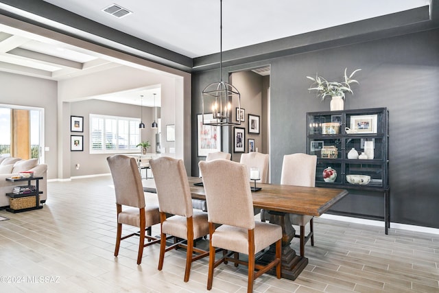 dining room featuring a chandelier and light hardwood / wood-style floors