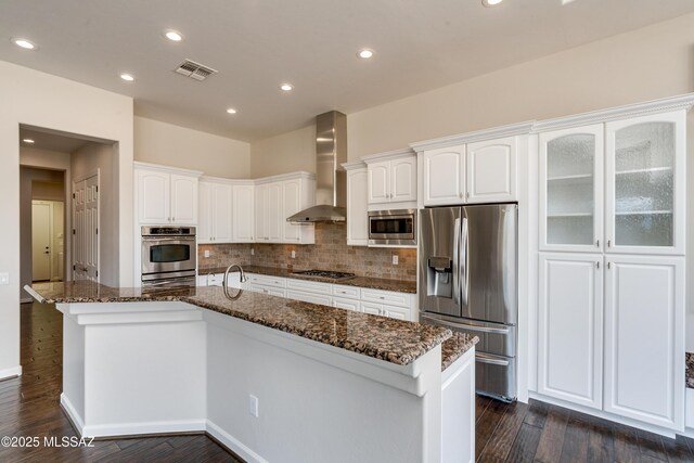 kitchen featuring appliances with stainless steel finishes, extractor fan, a wealth of natural light, and sink