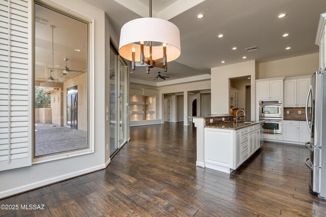 dining room with dark hardwood / wood-style flooring