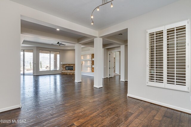 carpeted living room featuring built in features and ceiling fan