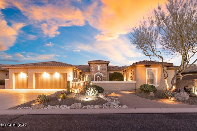 mediterranean / spanish house featuring a garage