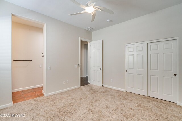 laundry room with cabinets, separate washer and dryer, dark tile patterned flooring, and sink