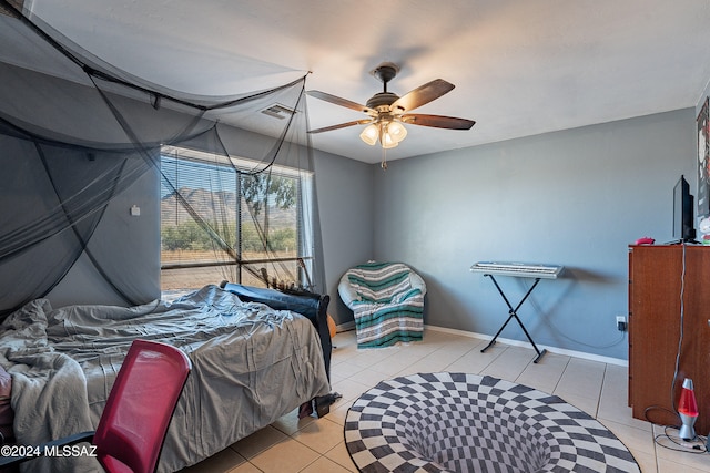 bedroom featuring ceiling fan and light tile patterned floors