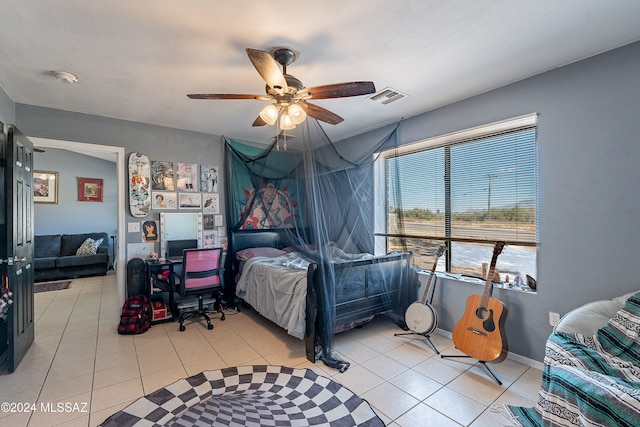 tiled bedroom with ceiling fan