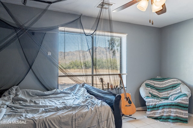 bedroom with light tile patterned floors and ceiling fan