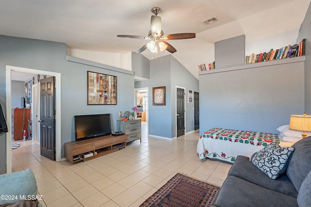 bedroom featuring ceiling fan, light tile patterned flooring, and vaulted ceiling