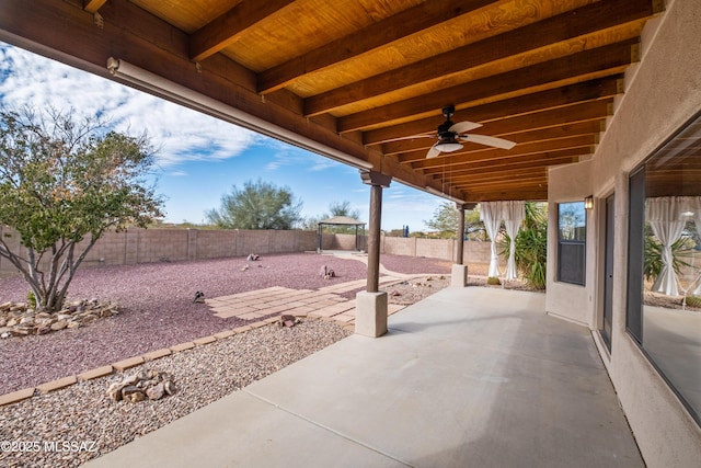 view of patio featuring ceiling fan