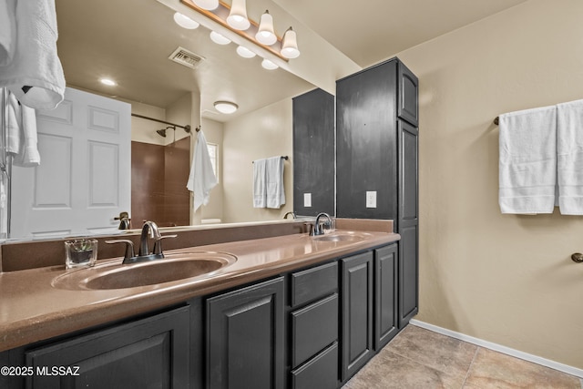 bathroom featuring tile patterned floors and vanity