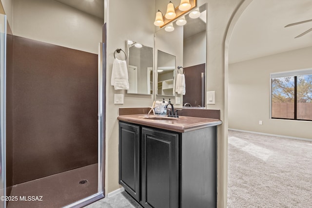 bathroom with ceiling fan and vanity