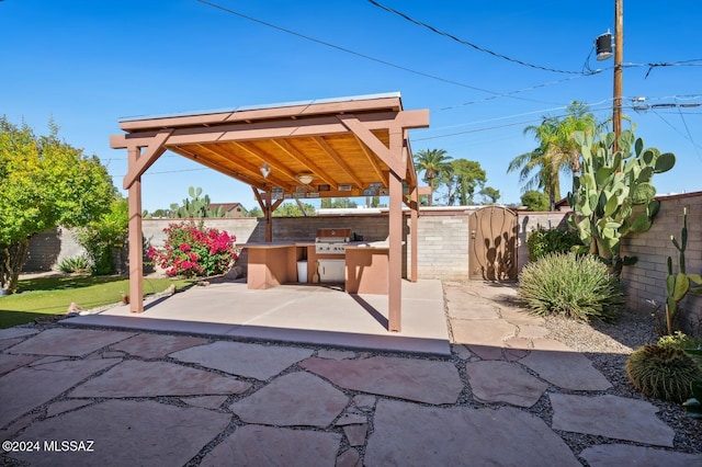 view of patio featuring an outdoor kitchen and area for grilling