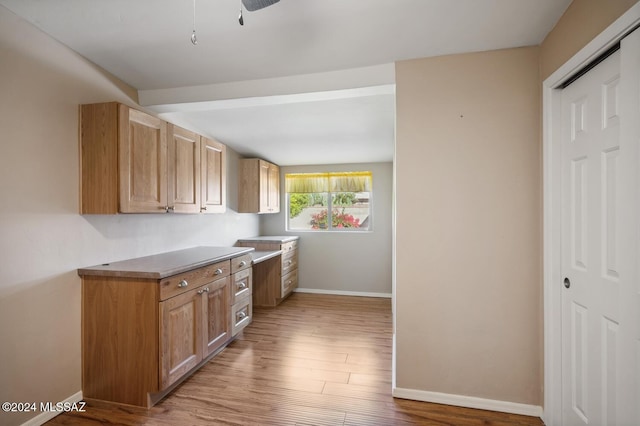 kitchen with ceiling fan and light wood-type flooring