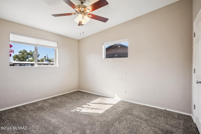 unfurnished room with ceiling fan, carpet, and vaulted ceiling