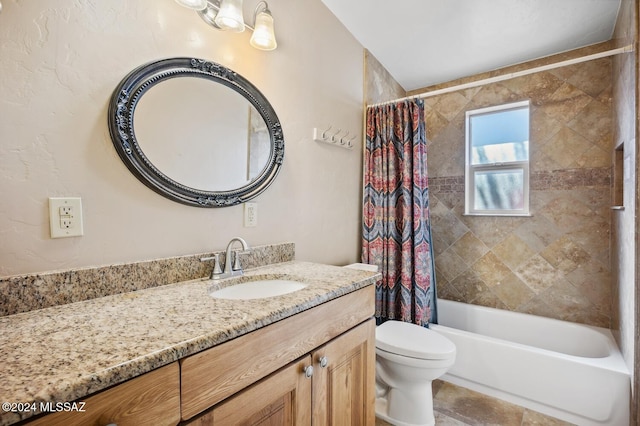 full bathroom with vanity, toilet, and shower / bath combo with shower curtain