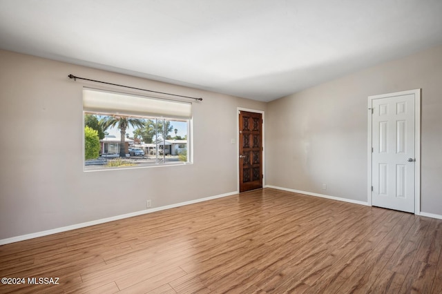 empty room with light wood-type flooring