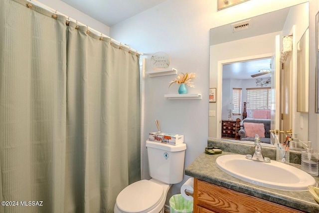 bathroom with vanity and toilet