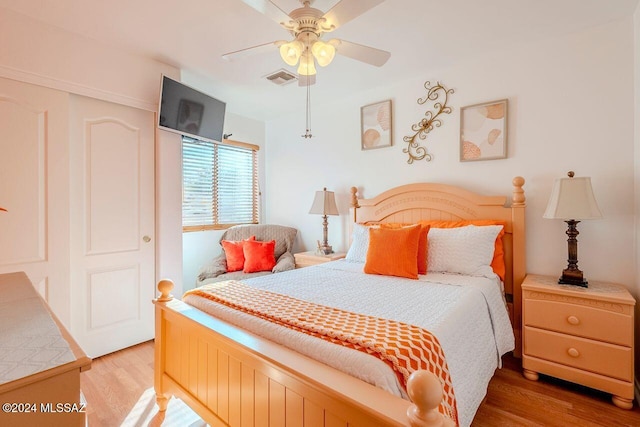 bedroom featuring ceiling fan and hardwood / wood-style flooring