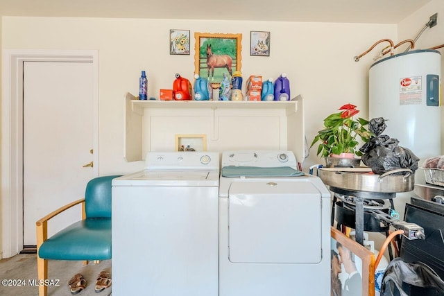 washroom featuring washer and clothes dryer and water heater