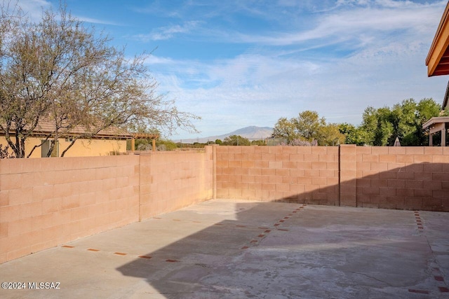 view of patio / terrace featuring a mountain view