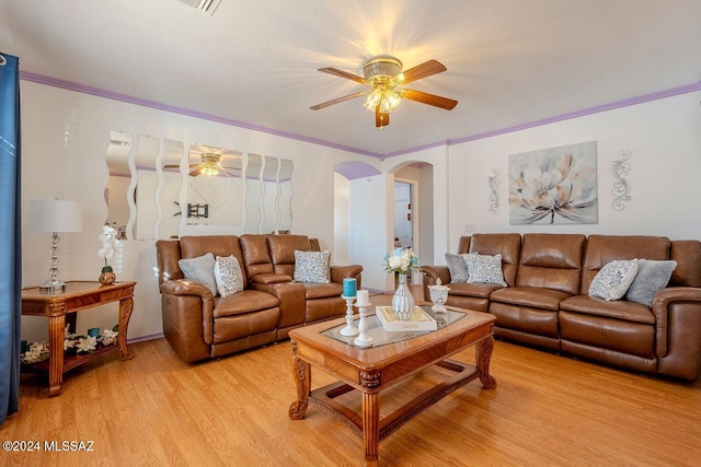 living room with ceiling fan, light hardwood / wood-style floors, and ornamental molding