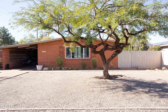 view of front of property featuring a carport