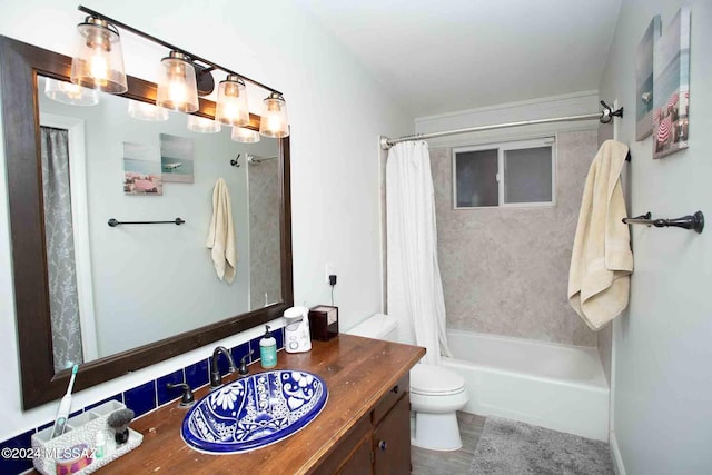 full bathroom featuring vanity, toilet, and shower / bath combo with shower curtain