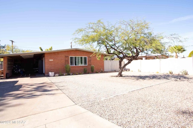 view of front facade with a carport