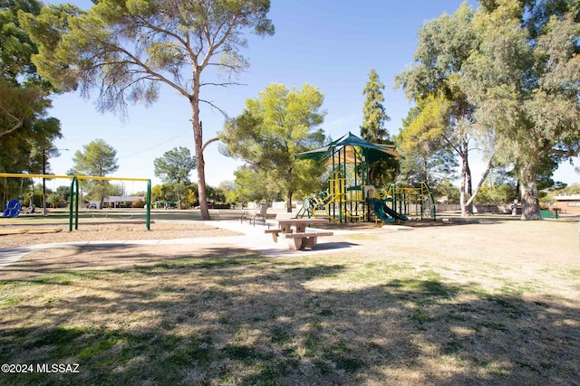 view of jungle gym with a lawn