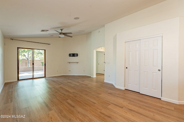 interior space with vaulted ceiling, ceiling fan, and light hardwood / wood-style flooring