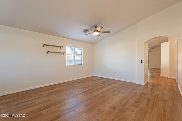 unfurnished room featuring vaulted ceiling, ceiling fan, and light hardwood / wood-style floors