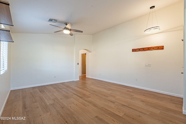 unfurnished room featuring ceiling fan and light wood-type flooring