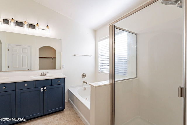 bathroom featuring vanity, tile patterned floors, separate shower and tub, and lofted ceiling