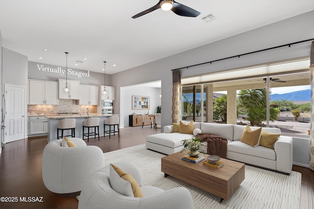 60241 E Arroyo Grande Dr, Oracle, AZ 85623 - living room with a ceiling fan, recessed lighting, a mountain view, and dark wood-style floors