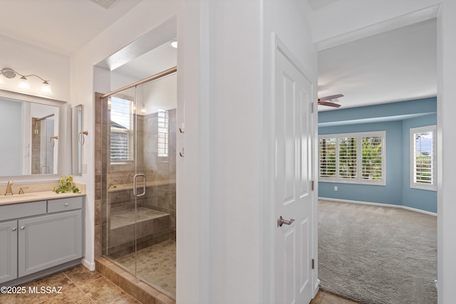 60241 E Arroyo Grande Dr, Oracle, AZ 85623 - bathroom featuring a stall shower, vanity, baseboards, and a ceiling fan