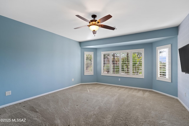 60241 E Arroyo Grande Dr, Oracle, AZ 85623 - empty room featuring a ceiling fan, carpet, and baseboards