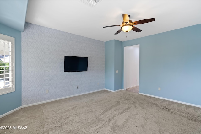 60241 E Arroyo Grande Dr, Oracle, AZ 85623 - carpeted spare room featuring a ceiling fan and baseboards
