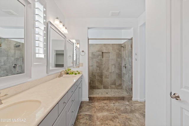 60241 E Arroyo Grande Dr, Oracle, AZ 85623 - bathroom with a stall shower, baseboards, and double vanity
